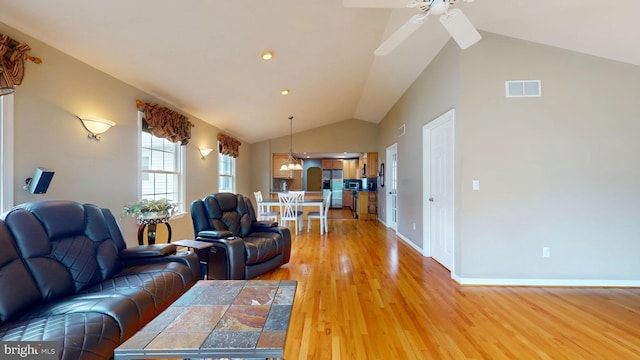 38 Ward Ave, Audubon, NJ 08106 - living room with vaulted ceiling, light wood finished floors, ceiling fan, and baseboards