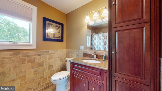 38 Ward Ave, Audubon, NJ 08106 - full bath featuring tile walls, toilet, vanity, wainscoting, and a shower with shower curtain