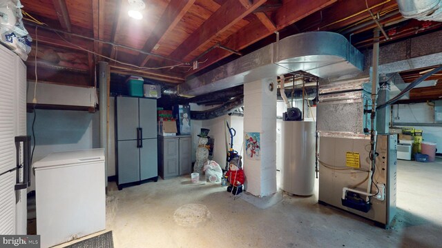 38 Ward Ave, Audubon, NJ 08106 - unfinished basement with water heater, fridge, and heating unit