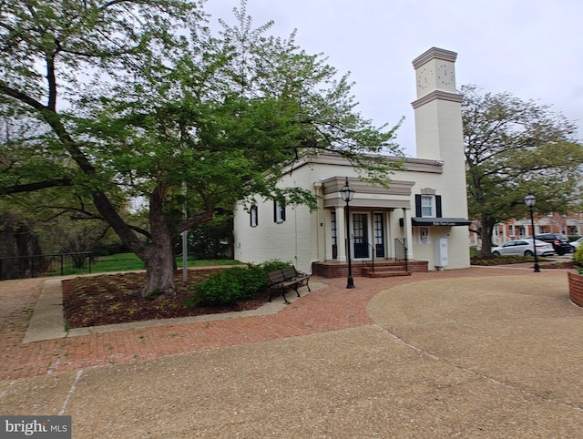 1413 Belle View Blvd Unit C1, Alexandria, VA 22307 - view of front facade featuring brick siding and a chimney