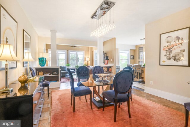 dining space with healthy amount of natural light and baseboards