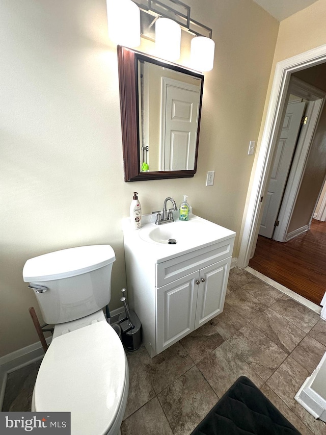 912 Evesham Ave, Baltimore, MD 21212 - half bath with vanity, toilet, and baseboards