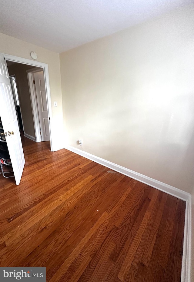 912 Evesham Ave, Baltimore, MD 21212 - unfurnished room featuring baseboards, wood finished floors, and a smoke detector