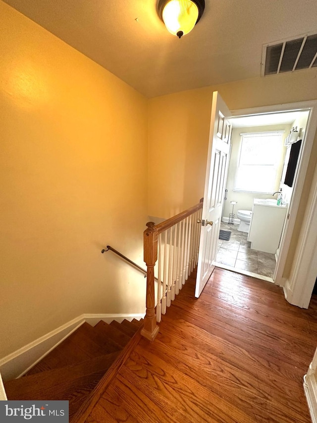 912 Evesham Ave, Baltimore, MD 21212 - stairway featuring wood finished floors and baseboards