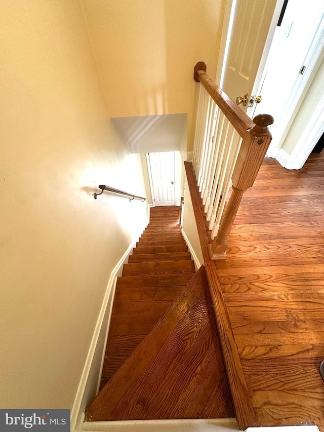 912 Evesham Ave, Baltimore, MD 21212 - stairs featuring wood finished floors and baseboards
