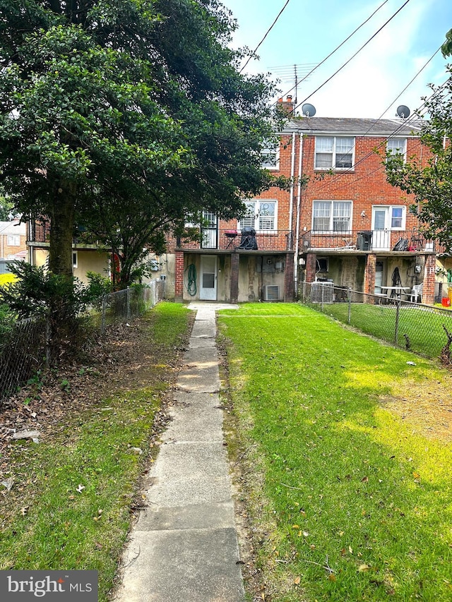 912 Evesham Ave, Baltimore, MD 21212 - rear view of house with brick siding and central AC