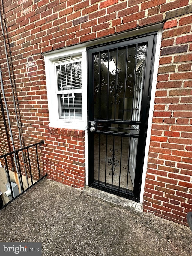 912 Evesham Ave, Baltimore, MD 21212 - view of exterior entry featuring brick siding