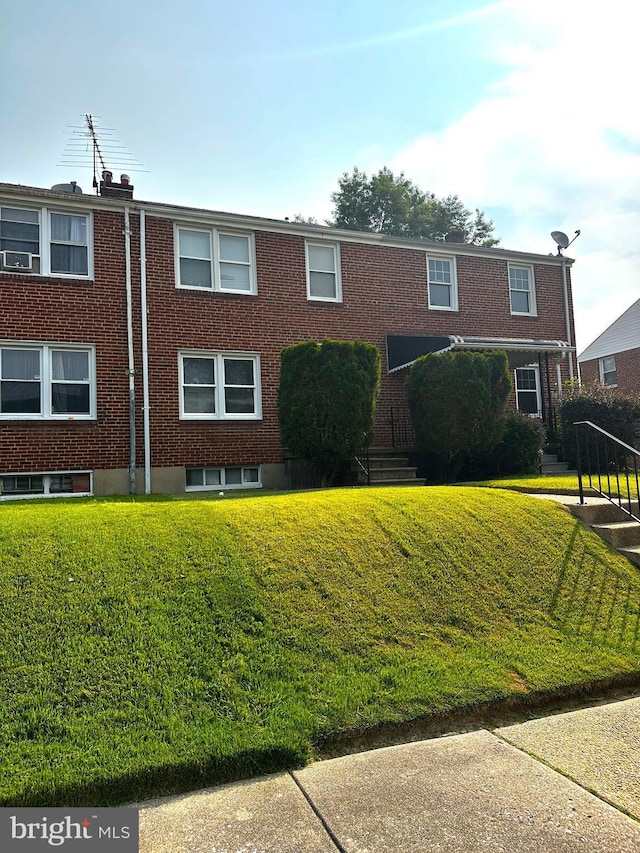 912 Evesham Ave, Baltimore, MD 21212 - view of front of home featuring a front yard and brick siding