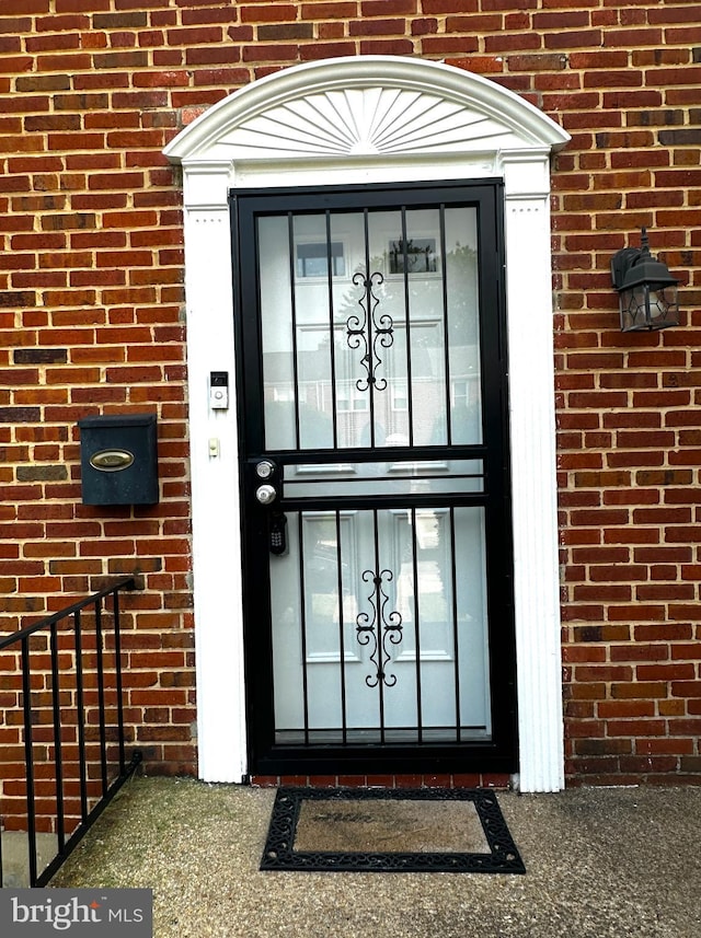 912 Evesham Ave, Baltimore, MD 21212 - doorway to property with brick siding