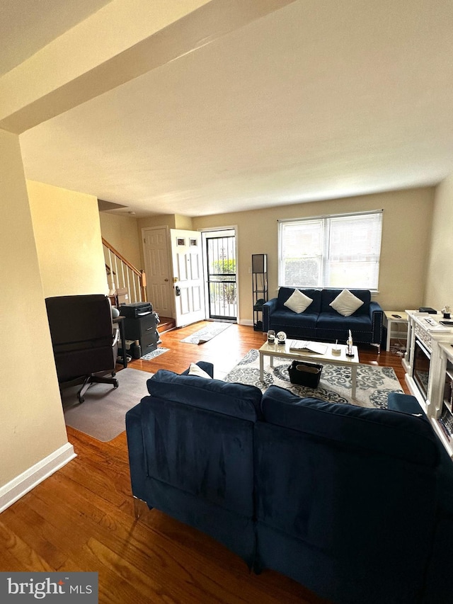 912 Evesham Ave, Baltimore, MD 21212 - living room with stairs, baseboards, and wood finished floors