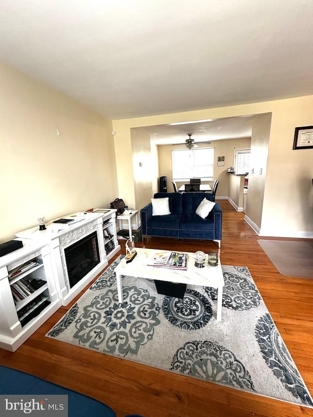 912 Evesham Ave, Baltimore, MD 21212 - living room featuring wood finished floors, ceiling fan, and baseboards