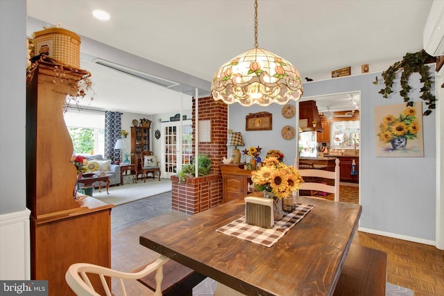 400 Hill Cir, Reading, PA 19607 - dining room featuring a wall unit AC and a chandelier