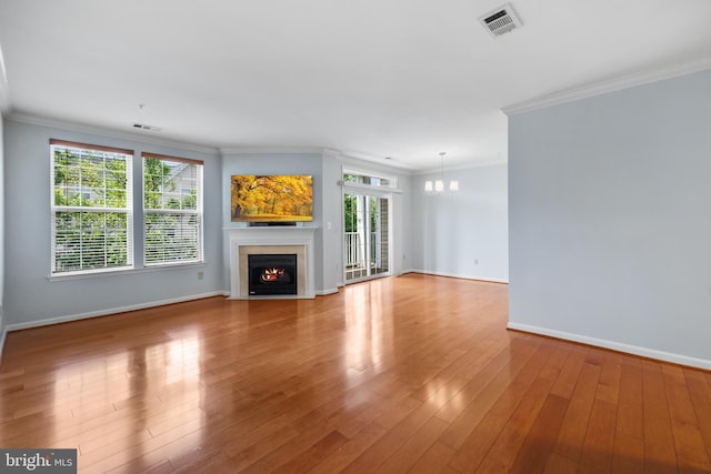 4950 Brenman Park Dr Unit 301, Alexandria, VA 22304 - unfurnished living room with a fireplace with flush hearth, baseboards, a chandelier, wood finished floors, and ornamental molding