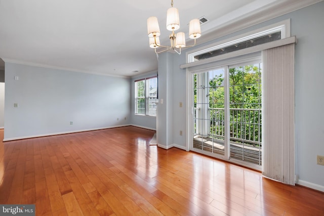 4950 Brenman Park Dr Unit 301, Alexandria, VA 22304 - unfurnished room with a chandelier, light wood-style floors, baseboards, and crown molding