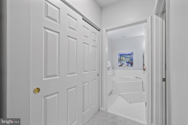 4950 Brenman Park Dr Unit 301, Alexandria, VA 22304 - bathroom with a garden tub and tile patterned floors