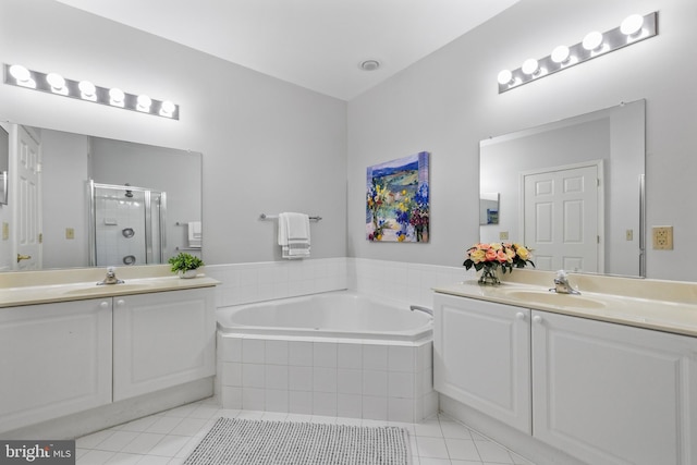 4950 Brenman Park Dr Unit 301, Alexandria, VA 22304 - full bathroom featuring tile patterned floors, a shower stall, vanity, and a garden tub