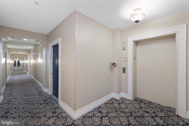 4950 Brenman Park Dr Unit 301, Alexandria, VA 22304 - corridor with carpet flooring, elevator, and baseboards