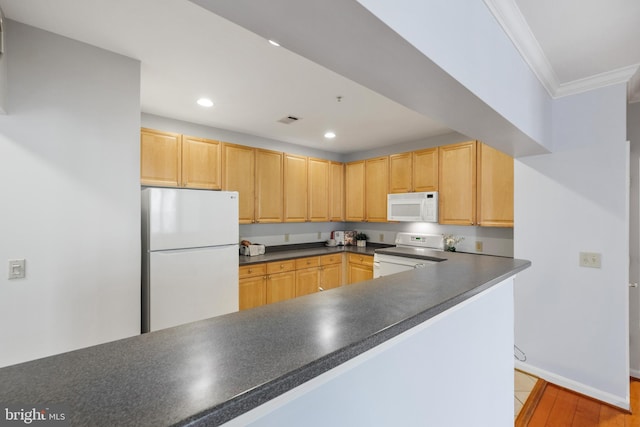 4950 Brenman Park Dr Unit 301, Alexandria, VA 22304 - kitchen with white appliances, dark countertops, crown molding, light brown cabinets, and recessed lighting