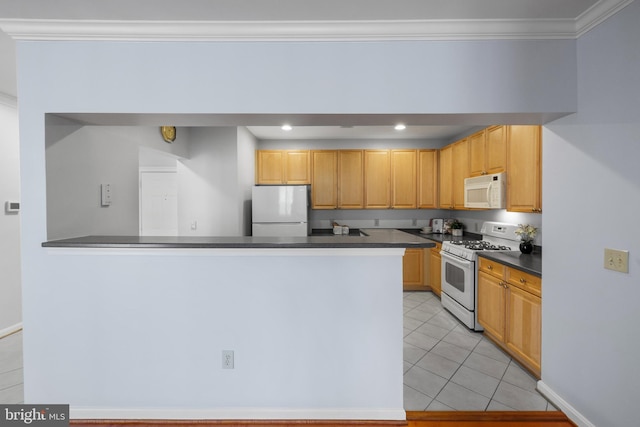 4950 Brenman Park Dr Unit 301, Alexandria, VA 22304 - kitchen featuring white appliances, dark countertops, light tile patterned floors, ornamental molding, and a peninsula