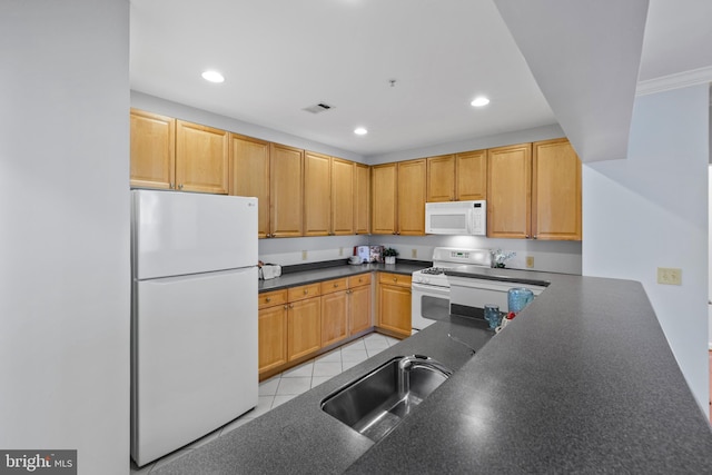 4950 Brenman Park Dr Unit 301, Alexandria, VA 22304 - kitchen featuring white appliances, a sink, dark countertops, and recessed lighting
