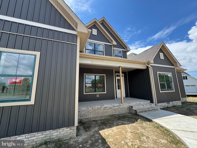 26171 Millman Dr, Hebron, MD 21830 - entrance to property featuring a porch and board and batten siding