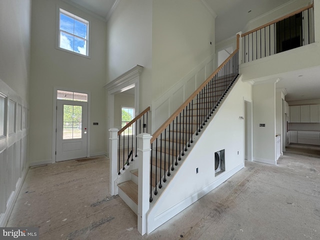 26171 Millman Dr, Hebron, MD 21830 - foyer entrance with a high ceiling, plenty of natural light, stairs, ornamental molding, and baseboards