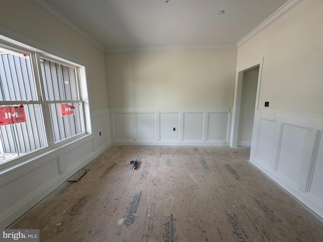 26171 Millman Dr, Hebron, MD 21830 - spare room featuring a decorative wall, wainscoting, and crown molding