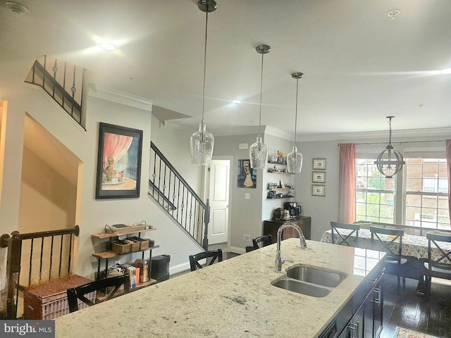 211 Clear Sky Way, Pasadena, MD 21122 - kitchen featuring a sink, ornamental molding, decorative light fixtures, light stone countertops, and baseboards