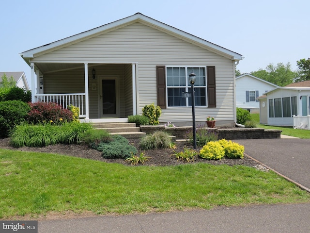 538 Haventree Ct, New Hope, PA 18938 - view of front of home featuring covered porch and a front yard