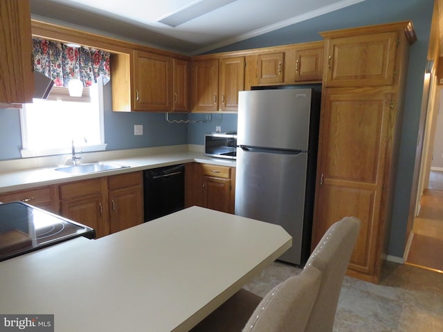 538 Haventree Ct, New Hope, PA 18938 - kitchen featuring appliances with stainless steel finishes, vaulted ceiling, a sink, light countertops, and brown cabinets