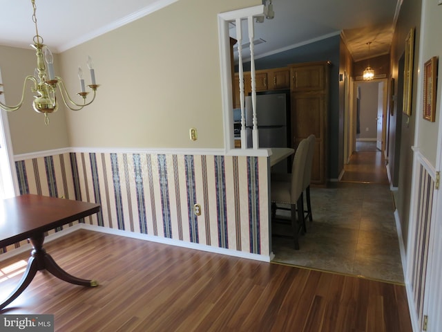 538 Haventree Ct, New Hope, PA 18938 - dining room with wood finished floors, a chandelier, and ornamental molding