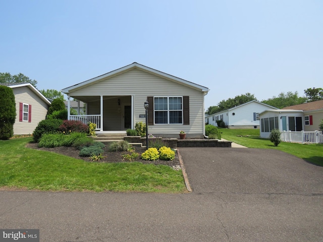 538 Haventree Ct, New Hope, PA 18938 - view of front of home with a porch, driveway, and a front lawn
