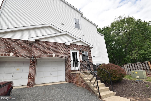 1304 Cranesbill Ct Unit 304, Belcamp, MD 21017 - view of front of property featuring brick siding, driveway, and an attached garage