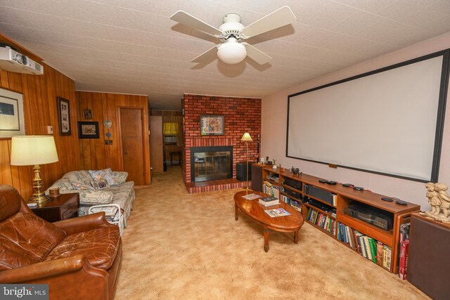 206-208 N 10th St, Oakland, MD 21550 - carpeted home theater with a ceiling fan, a brick fireplace, and wooden walls