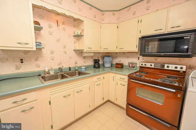 206-208 N 10th St, Oakland, MD 21550 - kitchen with black microwave, electric range oven, a sink, washer / dryer, and open shelves