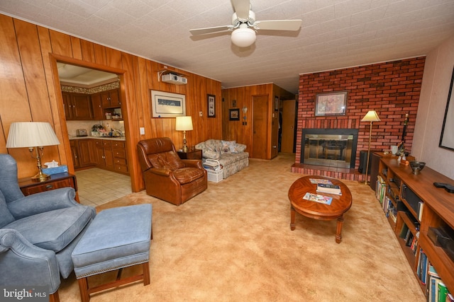 206-208 N 10th St, Oakland, MD 21550 - living area featuring ceiling fan, wooden walls, a brick fireplace, and light carpet