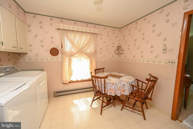 206-208 N 10th St, Oakland, MD 21550 - dining room with a baseboard radiator, wallpapered walls, washer and dryer, and light floors