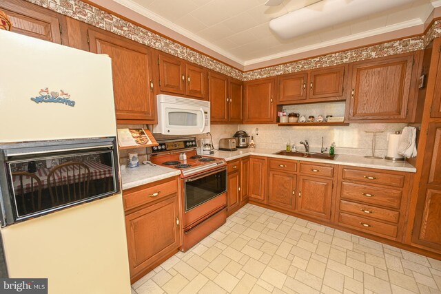 206-208 N 10th St, Oakland, MD 21550 - kitchen featuring white appliances, a sink, light countertops, ornamental molding, and brown cabinets