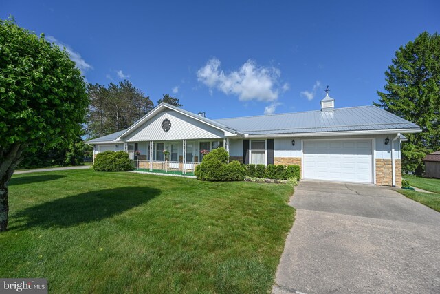 206-208 N 10th St, Oakland, MD 21550 - ranch-style house with a front lawn, a garage, concrete driveway, and stone siding