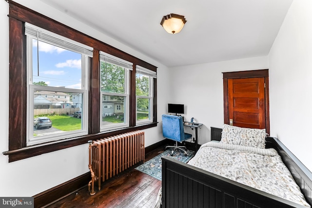 1112 Randall Ave, Upper Chichester, PA 19061 - bedroom with radiator heating unit, hardwood / wood-style flooring, baseboards, and a desk