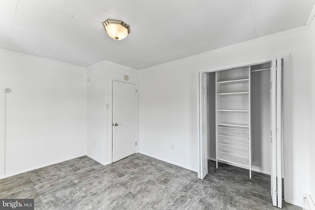 1112 Randall Ave, Upper Chichester, PA 19061 - unfurnished bedroom with baseboard heating and a closet