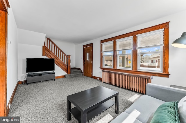1112 Randall Ave, Upper Chichester, PA 19061 - carpeted living area with stairs, baseboards, and radiator heating unit