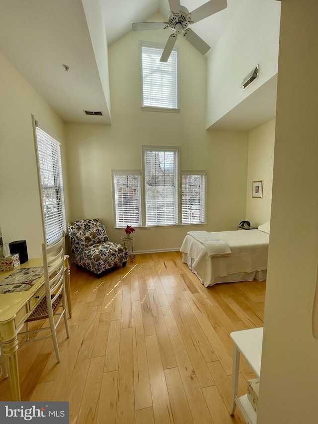 1369 Garden Wall Cir Unit 714, Reston, VA 20194 - bedroom featuring high vaulted ceiling, hardwood / wood-style floors, and a ceiling fan