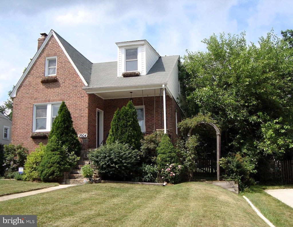 2904 Rosalie Ave, Baltimore, MD 21234 - view of front facade with brick siding, a front lawn, a chimney, and roof with shingles