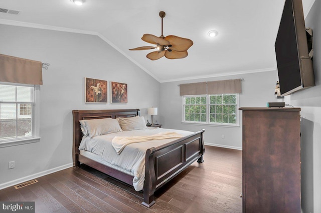 bedroom with vaulted ceiling, baseboards, wood finished floors, ornamental molding, and a ceiling fan