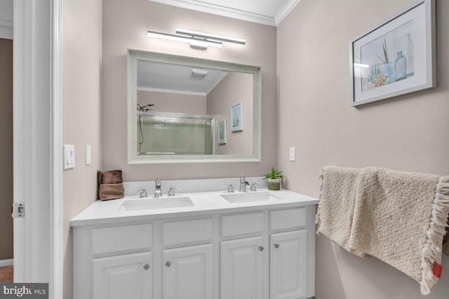 bathroom featuring ornamental molding, an enclosed shower, and double vanity