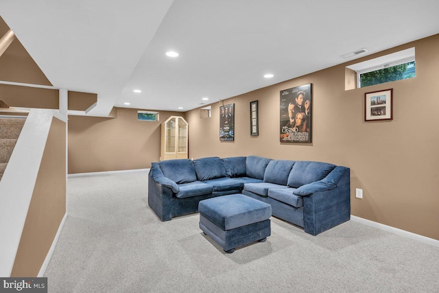carpeted living room with recessed lighting and baseboards