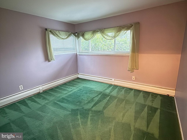 carpeted empty room featuring baseboards