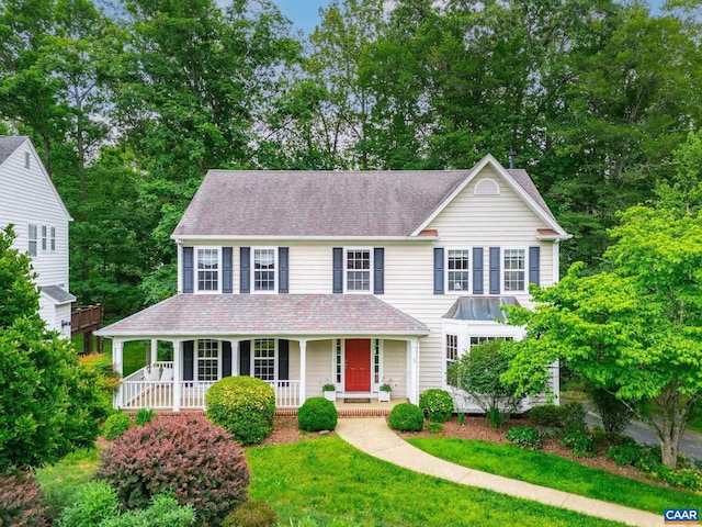 2657 Coralberry Pl, Charlottesville, VA 22911 - colonial house with covered porch, roof with shingles, and view of wooded area