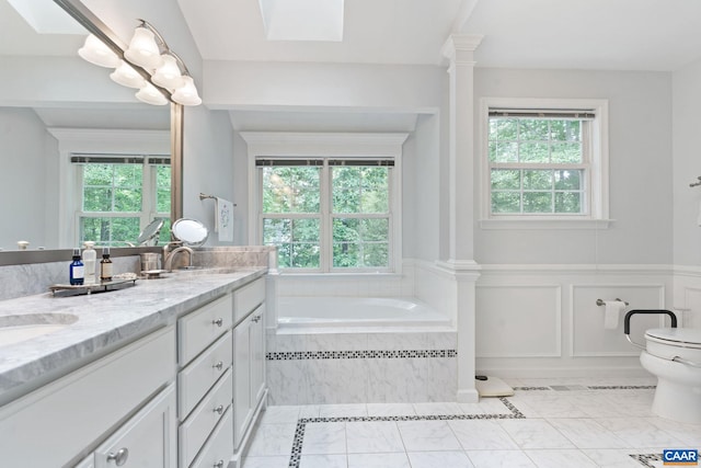 2657 Coralberry Pl, Charlottesville, VA 22911 - full bath with plenty of natural light, toilet, double vanity, tiled bath, and wainscoting
